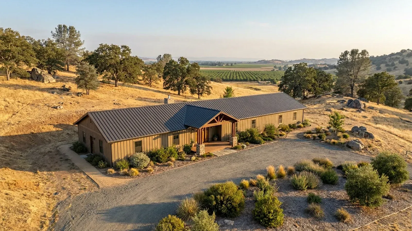 A completed single-story barndominium with a long, low roofline and no upper-level windows.